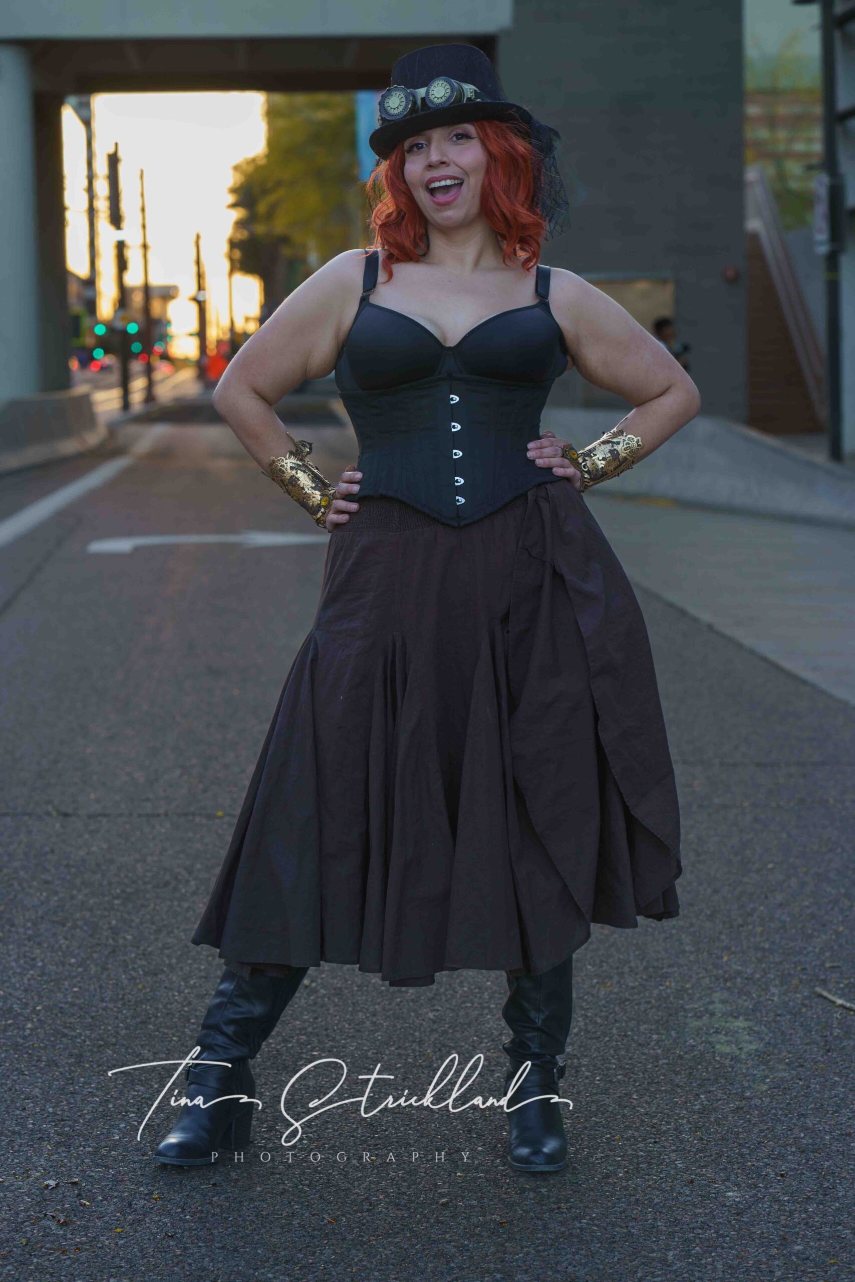 Dark-haired woman dressed in a steampunk images.